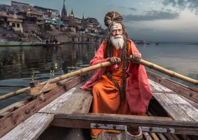 A sage rowing a boat in 1000 Buddha Empowerment Pilgrimages, Nepal, India