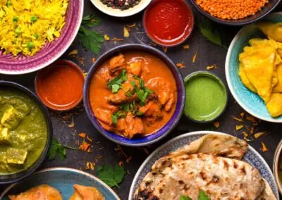 A table laden with Indian cuisine.