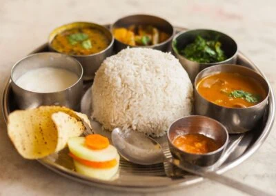 A tray brimming with South Indian cuisine