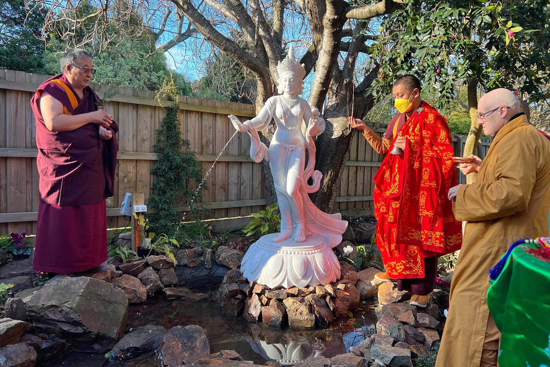 H.E. Kathog Rigzin Chenpo Rinpoche and Khentrul Rinpoche offer blessings to a graceful white Arya Tara statue.